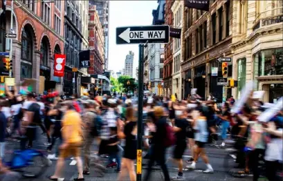  ?? Demetrius Freeman/The New York Times ?? Protesters walk through New York on June 8.