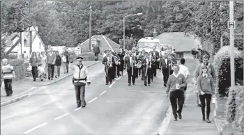  ?? 01_B34twe03 ?? Marching through Brodick the Dalkeith and Monkton Colliery Band joined Arran Brass at their concert last Saturday to a delightful­ly full hall.