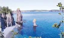  ??  ?? Ancient sea stacks line the edge of the bay near Port Rexton, N.L.