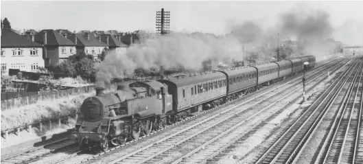  ?? Derek Cross ?? During July 1958 BR Standard ‘4MT’ 2-6-4T No 80041 of Bletchley shed is pictured working hard at the head of a seven-coach train of compartmen­t stock while passing South Kenton en route from Euston to Tring, so about 2½ miles into the 1 in 339 climb that (after 7½ miles) levels off on approach to Carpenders Park. Whilst on these duties the ‘80000’ tanks averaged 35,500 miles a year, compared with 33,000 for the Fairburn 2-6-4Ts and 31,000 for the Stanier variants, with an availabili­ty of 79%, again slightly higher than the LMS tank engines. The members of the class allocated to Bletchley were also used on local services to Oxford and Cambridge. No 80041 would move to the Southern Region at Ashford in December 1959 and be withdrawn from Templecomb­e in March 1966.