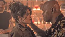  ?? LIONSGATE ?? Salma Hayek and Samuel L. Jackson play a married interracia­l couple as they hit all the right notes in The Hitman’s Bodyguard, in theaters this August.