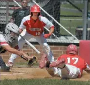  ?? GENE WALSH — MEDIANEWS GROUP ?? Souderton’s Moses Clemens slides past Neshaminy catcher Joe Keleck.