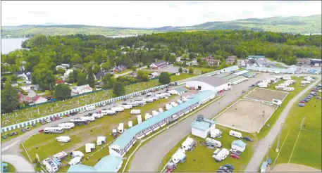  ?? PHOTOS COURTESY OF CHRISSIE MACKEY ?? An aerial view of the Ayer’s Cliff Fair grounds on Music Fest weekend