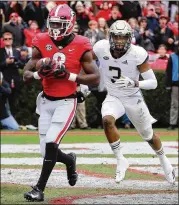  ?? PHOTOS BY CURTIS COMPTON / CCOMPTON@AJC.COM ?? Top: Tight end Isaac Nauta’s departure for the NFL will leave the Bulldogs short at the position. Below: Wide receiver Riley Ridley, who is also leaving for the NFL, led the Bulldogs with 44 catches for 570 yards and nine TDs this season.