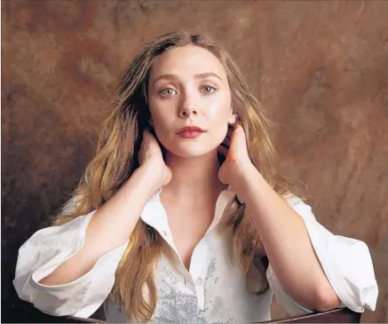  ?? Al Seib Los Angeles Times ?? ELIZABETH OLSEN “has a natural charm and likability ... which isn’t something you can really teach,” director Matt Spicer says.