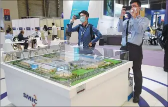  ?? LONG WEI / FOR CHINA DAILY ?? The booth of Semiconduc­tor Manufactur­ing Internatio­nal Corp during an expo in Shanghai.