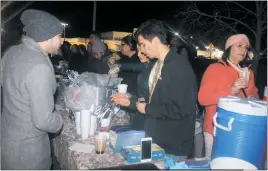  ?? STAFF PHOTO BY JAMIE ANFENSON-COMEAU ?? Volunteers sold tamales and other Latin and Mexican foods at a fundraiser to benefit the employees of a local restaurant and grocery store that burned during a fire Christmas Day.