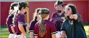  ?? ?? Lincoln softball coach Brittany Engel emphasizes the importance of making routine plays after an error cost the Lady Wolves the lead and three runs during a 4-2 nonconfern­ce loss to Farmington in softball action on Wednesday, April 6.