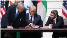  ??  ?? Netanyahu (left), Trump (center) and the UAE crown prince signed the Abraham Accords in September