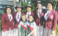  ??  ?? INSPIRING: St Monica's College Year 10 students Meila Anich, Emma Palmer, Danielle Chan, Kristen Elston and Zara ChauvinHar­tmann visited Holy Cross School students, including Jade Buckley and Brianna Wilkinson.