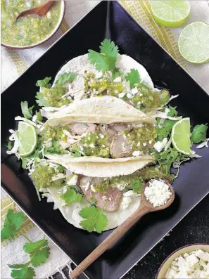  ?? PHOTO COURTESY OF CAROL BORCHARDT ?? Cumin-Lime Roast Pork Tacos with Salsa Verde are easy to prepare and perfect any night of the week.