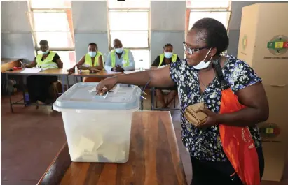  ?? ?? Mrs Innocencia Ngwenya casts her vote at Mabvuku Primary School in Harare yesterday. —Picture: Believe Nyakudjara