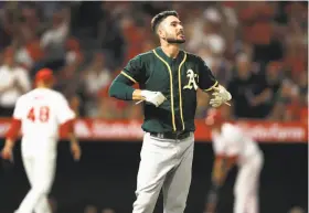  ?? Sean M. Haffey / Getty Images ?? Matt Joyce fouled out with the bases loaded to end the third inning of an 8-2 loss in Anaheim. The A’s are hitting .174 with runners in scoring position over their past 12 games. “Our guys understand we’re just in a little bit of a rut right now,” says...