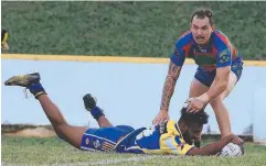  ??  ?? OVER THE LINE: Kangaroos’ Solomon Fauid stretches out for a try in the second half against Innisfail Brothers.