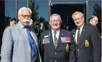  ??  ?? Truman Homes president George Trutina, left, and Legion members president Bill Cox, and dominion treasurer Mark Barham at the opening of the new Legion building in Kensington by Truman Homes.