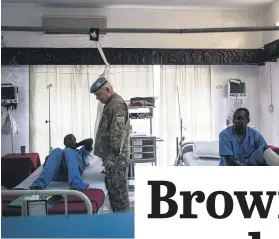  ?? Picture: AFP ?? CHECK UP. A United Nations military official visits wounded Tanzanian peacekeepe­rs in Goma yesterday.