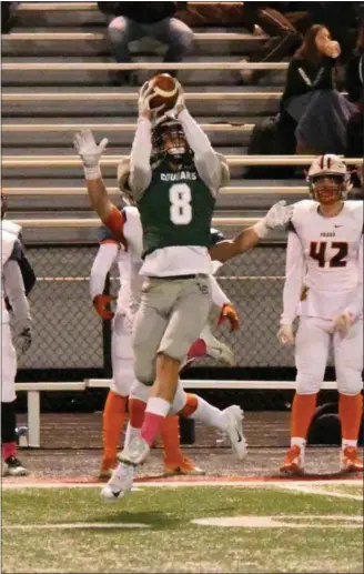  ?? PAUL DICICCO — FOR THE NEWS-HERALD ?? Lake Catholic’s Logan Hyduke eyes a pass during the Cougars’ victory over Padua on Oct. 25 at Jerome T. Osborne Sr. Stadium.