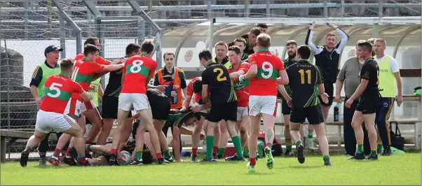  ??  ?? Rathnew and Hollywood players become enbroiled in a row during their SFC clash in Joule Park Aughrim.