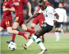  ??  ?? Sadio Mane scores a goal during the UEFA Champions League semi-final second leg match between AS Roma and Liverpool at the Olympic Stadium in Rome. — AFP photo