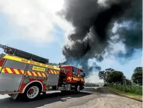  ?? PHOTO: SIMON O’CONNOR/STUFF ?? Multiple fire engines and tankers arrived at the scene.