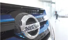  ??  ?? The Nissan logo is displayed on the front grill of a vehicle at the company’s global headquarte­rs in Yokohama. - Bloomberg photo