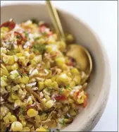  ?? MILK STREET VIA AP ?? This image released by Milk Street shows a recipe for charred corn with coconut, chilies and lime.