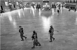  ?? MARY ALTAFFER/AP ?? National Guard members on patrol Wednesday at Grand Central Terminal in New York.