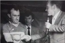  ??  ?? Micheál Kearins is congratula­ted by Co Board chairman John Higgins after he played his last match for St Pat’s in the 1982 County Final.