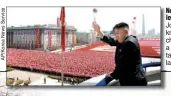  ??  ?? North Korean leader Kim Jong Un acknowledg­es cheers during a mass military parade last Sunday.