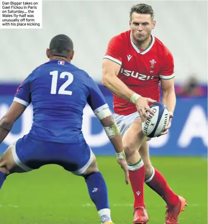  ??  ?? Dan Biggar takes on Gael Fickou in Paris on Saturday.... the Wales fly-half was unusually off form with his place kicking