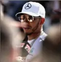  ?? MARK THOMPSON, GETTY IMAGES ?? Lewis Hamilton talks to the media during previews for the Australian Formula One Grand Prix on Thursday.