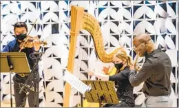  ?? COURTESY PHOTO BY GARY PAYNE ?? The Myriad Trio includes violist Che-Yen Chen (from left), harpist Julie Smith Phillips and flutist Demarre McGill.