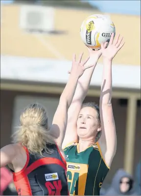  ??  ?? White Hills’ Janene Cass tries to block Colbinabbi­n’s Elizabeth Cobbledick.