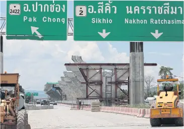  ?? WICHAN CHAROENKIA­TPAKUL ?? Heavy-duty vehicles at the constructi­on site for a motorway spanning Ayutthaya-Nakhon Ratchasima province, one of myriad PPP schemes.