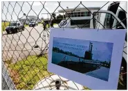  ?? VICENTE ROBLES / ASSOCIATED PRESS ?? A picture of the Argentine submarine ARA San Juan written in Spanish “Come on steel men. We will wait for you at home” hangs from the fence at the Naval Base in Mar del Plata, Argentina, on Sunday.