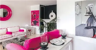  ??  ?? “As you can see, shocking pink is one of my favourite colours,” Lee Hennessy says about her apartment decor.