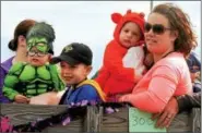  ?? DIGITAL FIRST MEDIA FILE PHOTO ?? Donna and Dominic Roselli, left, and Cole, Clay and Valerie Sebra ride in a hay wagon in the Harleysvil­le Rotary Club Halloween Parade.