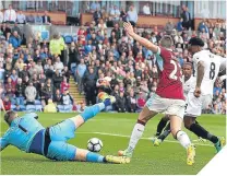  ??  ?? ■ Swansea’s Leroy Fer scores the game’s only goal.