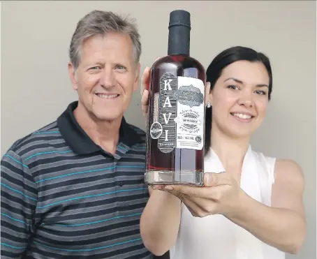  ?? JASON KRYK ?? Steve Wright and Jackie DeMarco are co-founders of Kavi Reserve, a new cold brewed coffee blended whisky that hit LCBOs last week. Kavi Reserve is double-aged in barrels, and a 750 ml bottle sells for $29.95.