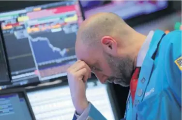 ?? REUTERS ?? Wall Street je potonuo tri posto, a europske burze pale su na najnižu razinu u dvije godine