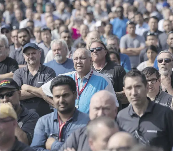  ?? CHRIS YOUNG/THE CANADIAN PRESS ?? Workers at a Bombardier plant in Toronto listen to Unifor national president Jerry Dias speak Wednesday amid mounting calls for Boeing to drop a trade complaint against Bombardier. Bombardier rejected claims that it is not co-operating with the probe.