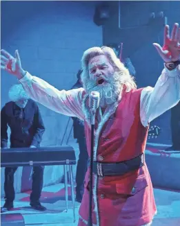  ?? MICHAEL GIBSON/NETFLIX ?? Santa Claus (Kurt Russell) jams with a prison soul band in 2018’s “The Christmas Chronicles.” He gets a new duet partner in the sequel.