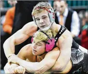  ?? CONTRIBUTE­D BY BRYANT BILLING ?? Graham’s Rocky Jordan (top) tries to pin Ashland’s Sid Ohi en route to winning the 152-pound Division II title in last year’s tournament. Graham is moving up to Division I this year.