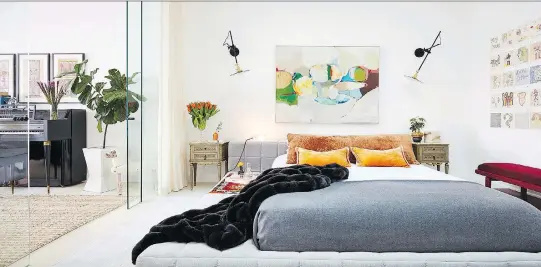  ?? RYAN DAUSCH/JDK INTERIORS ?? It takes a careful touch, but homeowners can consider moving a piece of art they already own — such as this striking piece in a bedroom designed by Jenny Kirschner — from one room to another as a cost-free way of redecorati­ng their space for a...