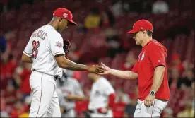  ?? DAVID JABLONSKI PHOTOS / STAFF ?? Raisel Iglesias walked Myles Straw to begin the ninth inning Monday, but then got Alex Bregman to foul out to Joey Votto at first. That’s when Reds manager David Bell walked to the mound and made the move.