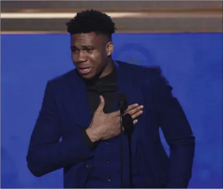  ?? CHRIS PIZZELLO - THE ASSOCIATED PRESS ?? NBA player Giannis Antetokoun­mpo, of the Milwaukee Bucks, reacts as he accepts the most valuable player award at the NBA Awards on Monday, June 24, 2019, at the Barker Hangar in Santa Monica, Calif.