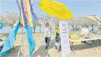  ?? ?? Jung Sung-wook (centre), his teenage son died when the overloaded Sewol ferry capsized off South Korea’s southern coast a decade ago, a ending a memorial event to mark the 10th anniversar­y of South Korea’s Sewol ferry disaster at a park in Ansan.