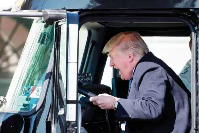  ??  ?? In this file photo taken on March 23, 2017 US President Donald Trump sits in the driver’s seat of a semi-truck as he welcomes truckers and CEOs to the White House in Washington to discuss healthcare.