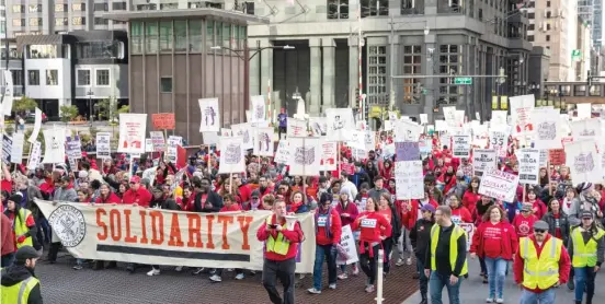  ?? ASHLEE REZIN GARCIA/SUN-TIMES ?? Thousands of Chicago Teachers Union members and their supporters march downtown during the teachers strike.