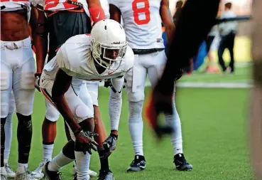  ?? [PHOTO BY KURT STEISS, FOR THE OKLAHOMAN] ?? Sophomore A.J. Green takes part in a drill during spring football practice at the Sherman E. Smith Training Center in Stillwater. Green is among the top contenders for a starting job at cornerback this fall.